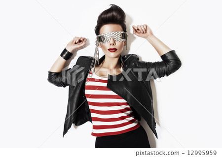 rock n roll woman in glasses and black jacket 12995959