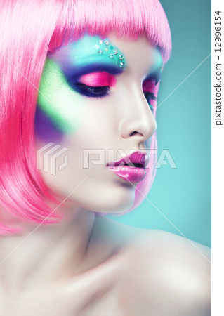 woman with pink hair and lips in blue light 12996154
