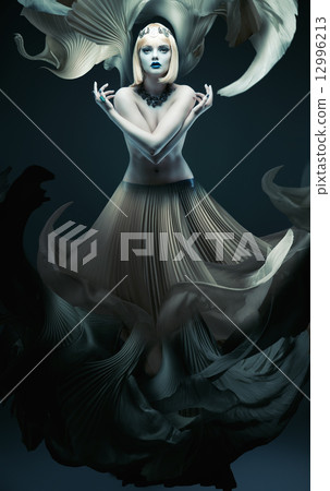 white blond woman in long dynamic skirt 12996213