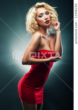 hot blond woman in red dress hot blond woman in red dress 12996289