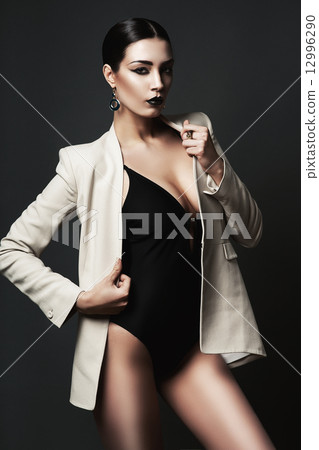 woman with black lips in blazer woman with black lips in blazer 12996290