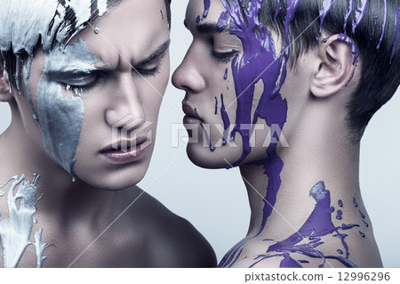 two handsome men in violet and silver paint two handsome men in violet and silver paint 12996296