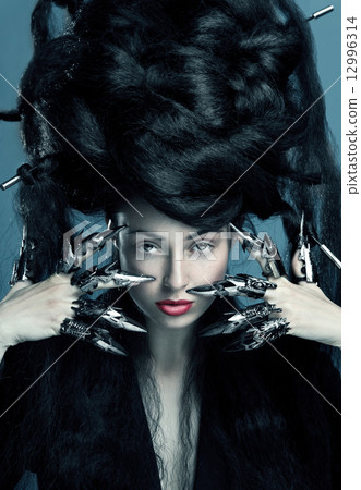 Fashion shot of a woman with bunch of hair on had Fashion shot of a woman with bunch of hair on had 12996314