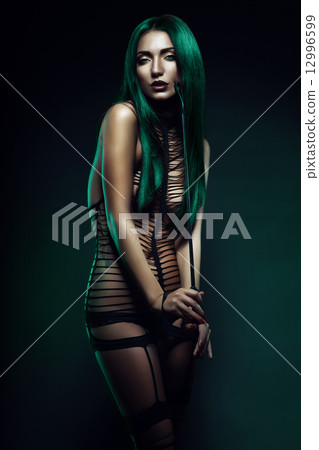 bdsm woman with whip on cheek bdsm woman with whip on cheek 12996599