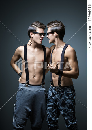 Two guys in the pants with suspenders 12996616