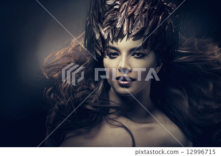 attractive woman with long hair and feather hat attractive woman with long hair and feather hat 12996715