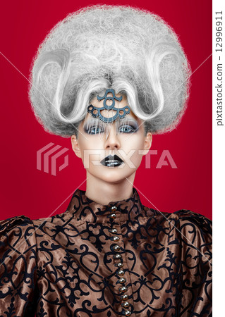 Close-up portrait of a woman with creative hairstyle 12996911