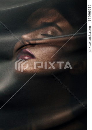 beautiful woman under transparent textile 12996912