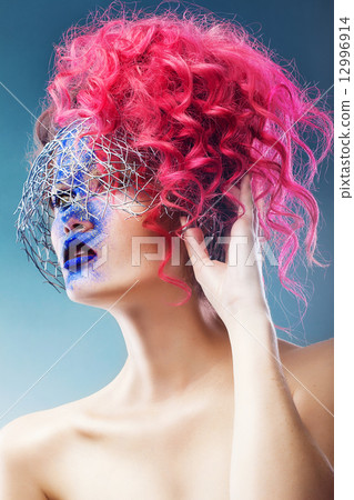 woman with wire web and pink hair 12996914