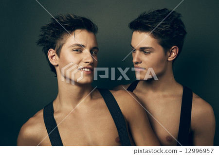 two smiling brothers in suspenders 12996957