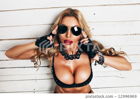 blond woman in sunglasses with big boobs 12996969
