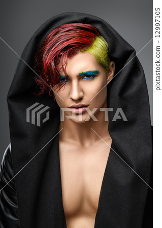 Portrait of the young sexual man in black cloak 12997105