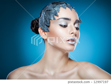 cold woman in accessory of silver leaves cold woman in accessory of silver leaves 12997197