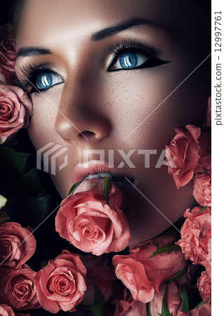 woman with pink rose in mouth woman with pink rose in mouth 12997761