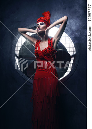 model in red in circle of light 12997777