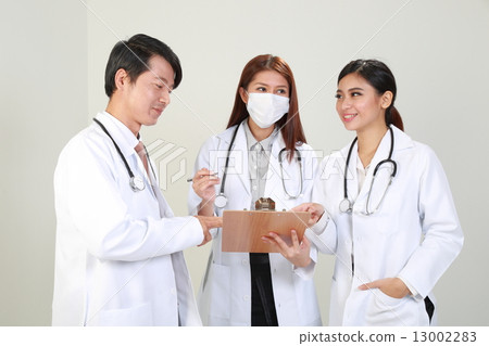 Group of male and female doctor discussion smile writing 13002283