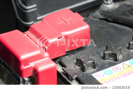 Car battery with red positive polarity. 13002619