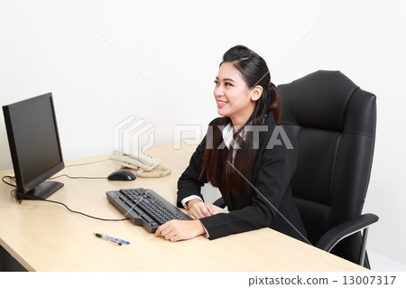 Female seating at table look front Female seating at table look front 13007317