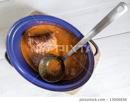 Roulade of beef in pan with sauce Roulade of beef in pan with sauce 13008686