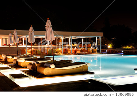 Swimming pool and bar in night illumination at the luxury hotel, 13009096