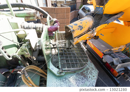 Placing of raw concrete by concrete pump car 13021280