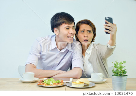 Asian , Young Couple , Selfie in Cafe 13021470