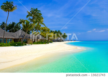 Beach bungalows on a tropical island Beach bungalows on a tropical island 13021743