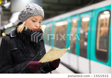 Lady waiting on subway station platform. 13022618