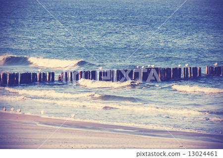 Vintage retro filtered picture of a beach, peaceful background. Vintage retro filtered picture of a beach, peaceful background. 13024461