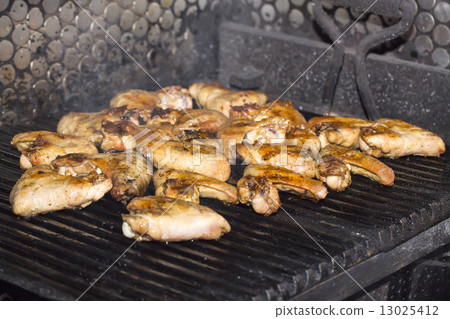 Wings Grill cooked on the grill in the restaurant 13025412
