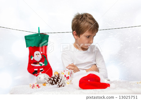 Portrait of sad boys with Christmas decorations. 13025751