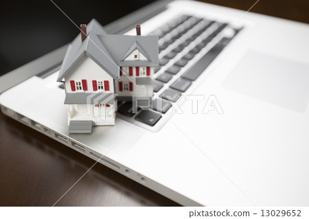 Miniature House on Laptop Computer Miniature House on Laptop Computer 13029652