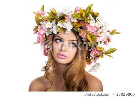 Beautiful woman with a wreath of flowers 13029800