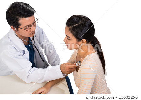 Doctor examining a concerned patient using stethoscope Doctor examining a concerned patient using stethoscope 13032256