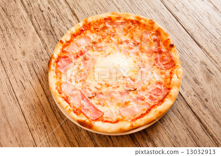 pizza on wooden background 13032913