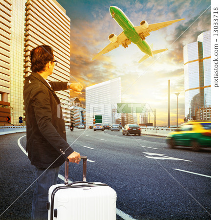 traveler man and luggage standing on traffic and looking to time traveler man and luggage standing on traffic and looking to time 13033718