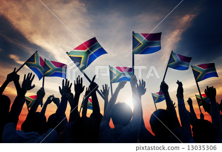 Group of People Waving South African Flags in Back Lit 13035306