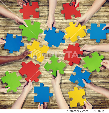 Group of Hands Holding Jigssaw Puzzle Group of Hands Holding Jigssaw Puzzle 13036048