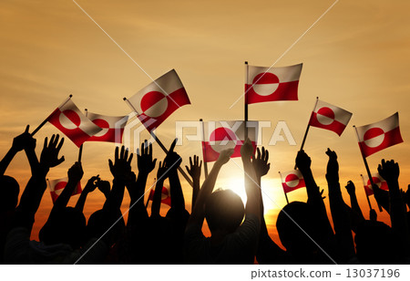 Silhouettes of People Holding Flag of Greenland Silhouettes of People Holding Flag of Greenland 13037196