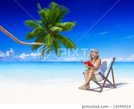 Woman Relaxing on the Beach 13040018
