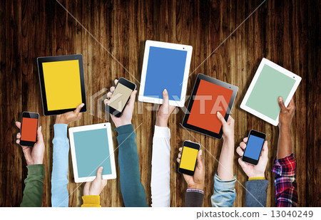 Group of Hands Holding Digital Devices Group of Hands Holding Digital Devices 13040249
