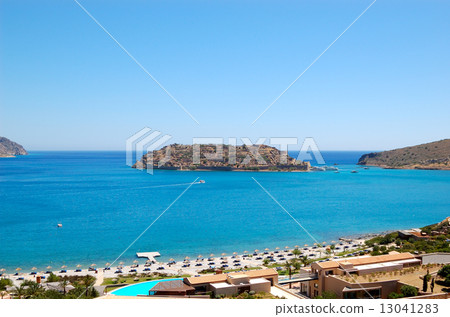 Beach of luxury hotel with a view on Spinalonga Island, Crete, Beach of luxury hotel with a view on Spinalonga Island, Crete, 13041283