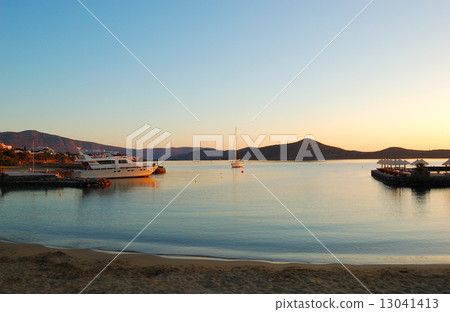 Beach of luxury hotel with yachts in morning sunlight, Crete, Gr 13041413