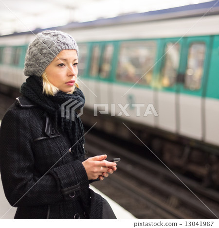 Woman on a subway station. 13041987