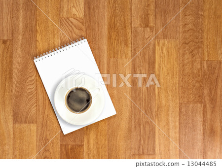 Blank notepad with office supplies and cup of coffee on wooden t Blank notepad with office supplies and cup of coffee on wooden t 13044485