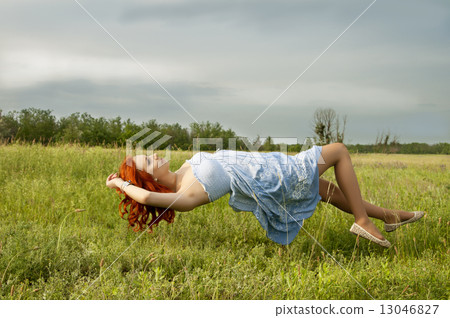 Levitating girl flying above the ground. Levitating girl flying above the ground. 13046827