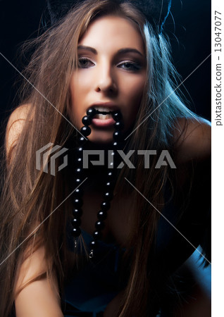 girl with a beautiful face and a passionate glance 13047077