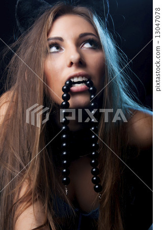 girl with a beautiful face and a passionate glance 13047078