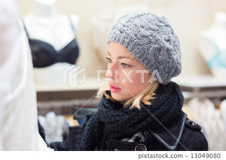 Beautiful lady shopping in lingerie store. 13049080