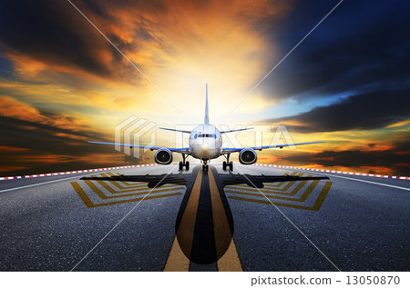 passenger jet plane preparing to take off from airport runways a passenger jet plane preparing to take off from airport runways a 13050870